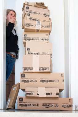 Woman being shocked by Amazon.com delivery clipart