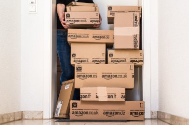 Woman receiving extensive Amazon.com delivery clipart