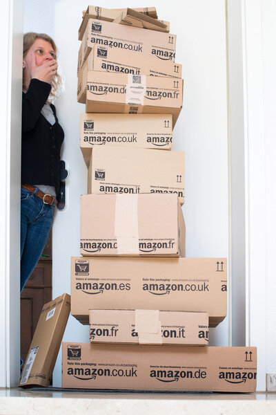 Woman being shocked by Amazon.com delivery