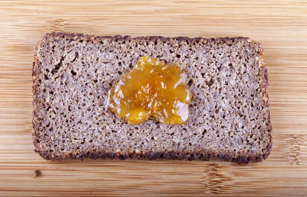 Jam on rye bread — Stock Photo, Image