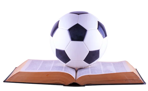 Bola de futebol sobre livro — Fotografia de Stock