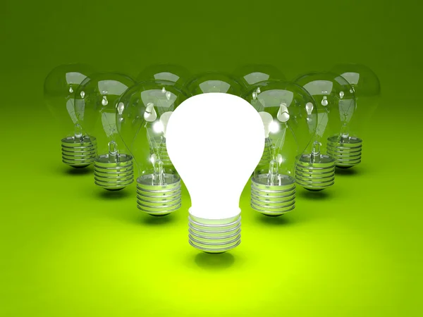 Group of light bulbs on green background — Stock Photo, Image