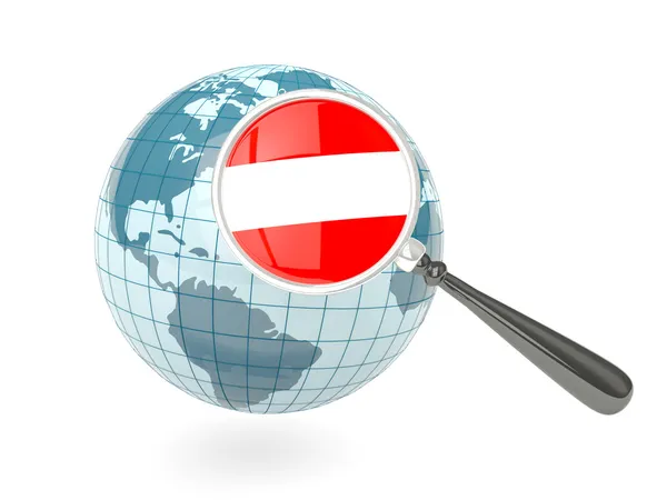 Magnified flag of austria with blue globe — Stock Photo, Image