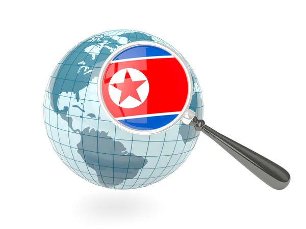 Förstorad flagga korea norr med blå glob — Stockfoto