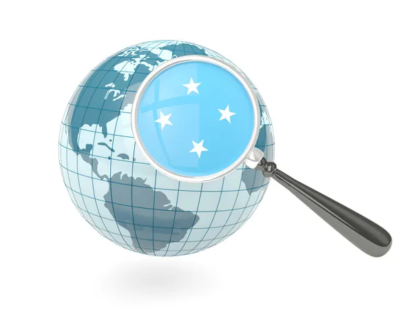 Magnified flag of micronesia with blue globe — Stock Photo, Image