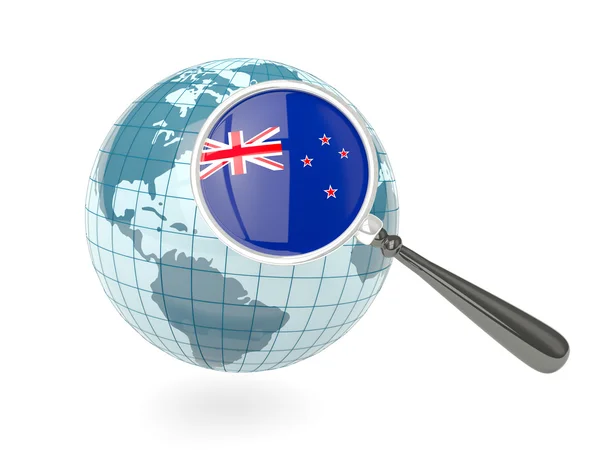 Magnified flag of new zealand with blue globe — Stock Photo, Image