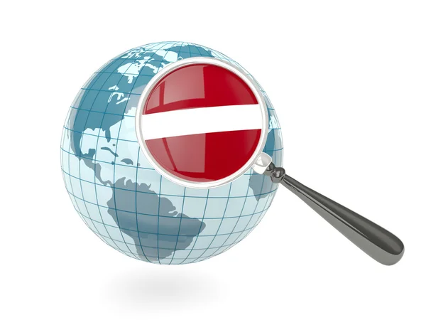 Magnified flag of latvia with blue globe — Stock Photo, Image