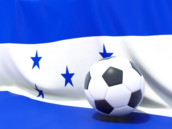 Honduras bayrağı önünde futbol ile — Stok fotoğraf