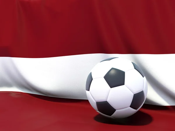 Bandera de latvia con fútbol delante — Foto de Stock