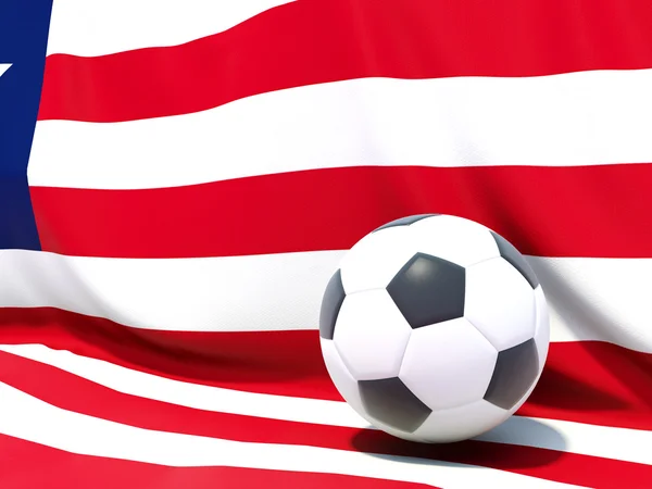 Liberya bayrağı önünde futbol ile — Stok fotoğraf