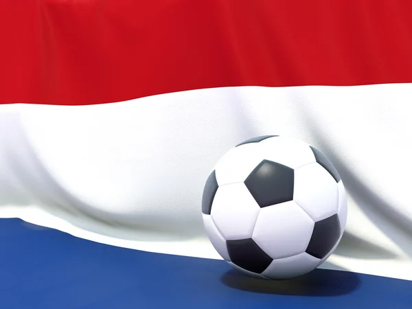 Bandeira de terras baixas com futebol à sua frente — Fotografia de Stock