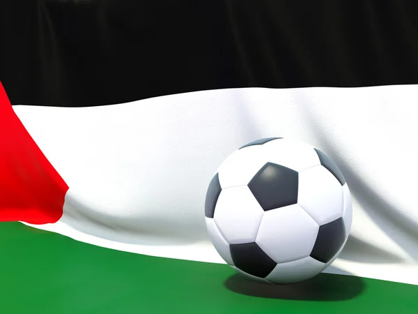Flaggan av palestinskt territorium med fotboll framför den — Stockfoto