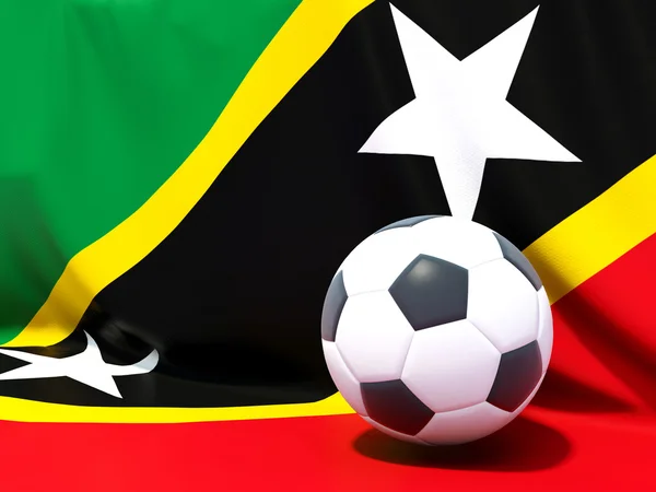 Flag of saint kitts and nevis with football in front of it — Stock Photo, Image