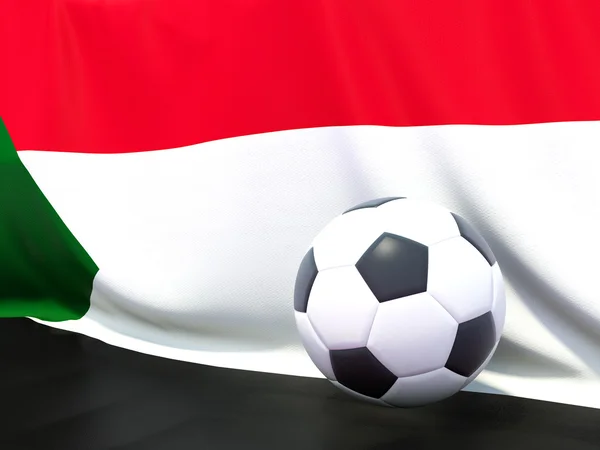 Flagga sudan med fotboll framför den — Stockfoto