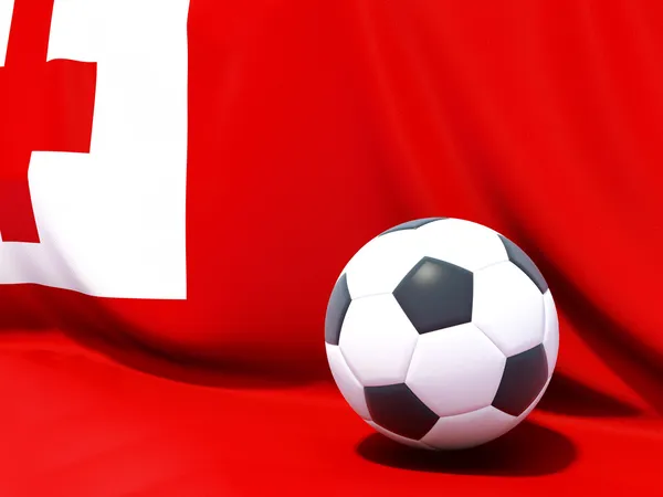 Flag of tonga with football in front of it — Stock Photo, Image