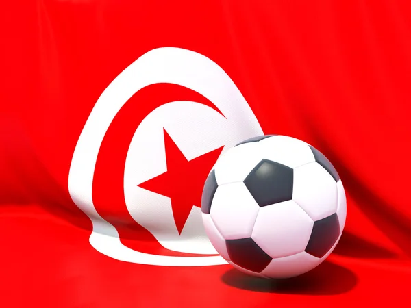 Flagga Tunisien med fotboll framför den — Stockfoto