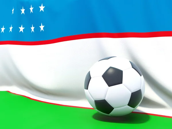 Bandeira do uzbequistão com futebol à sua frente — Fotografia de Stock