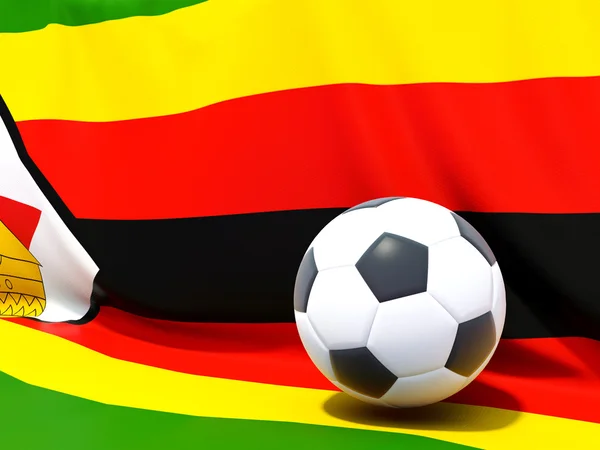 Drapeau de zimbabwe avec le football devant lui — Photo