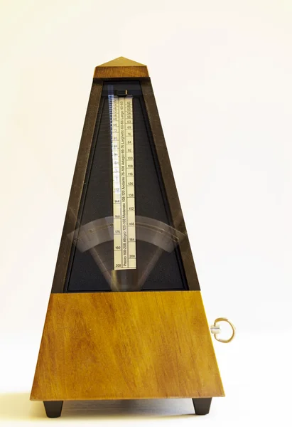 Wooden Mechanical Metronome with blurred arm moving — Stock Photo, Image