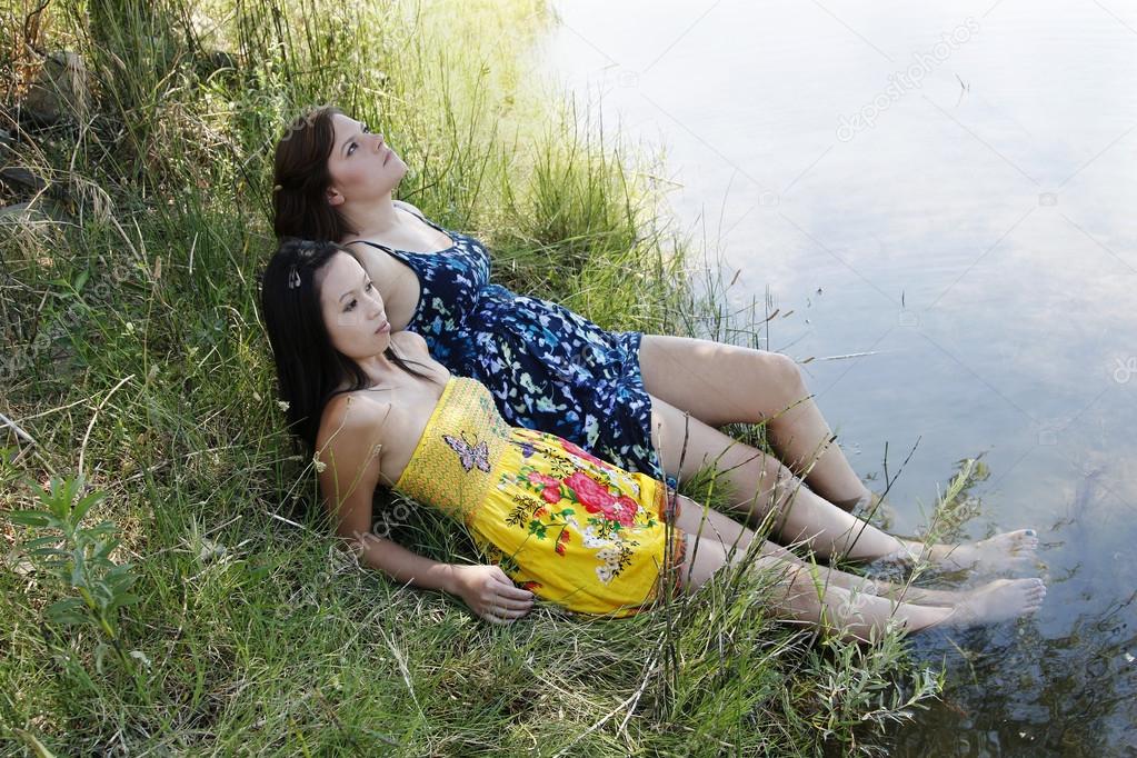Two Women Outdoors River Dresses Feet In Water