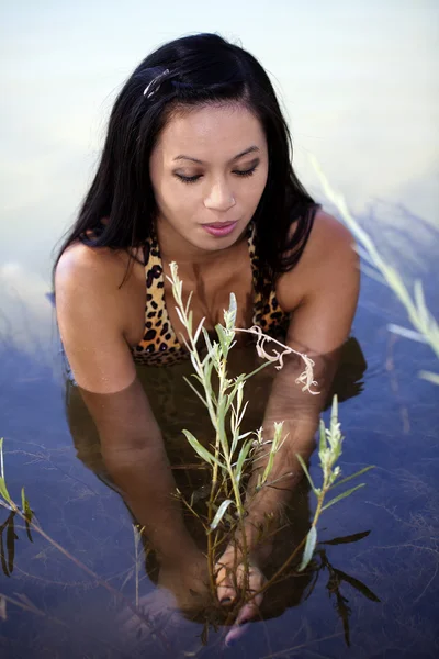 Asian American Woman In River Holding Plant — Stock Photo, Image