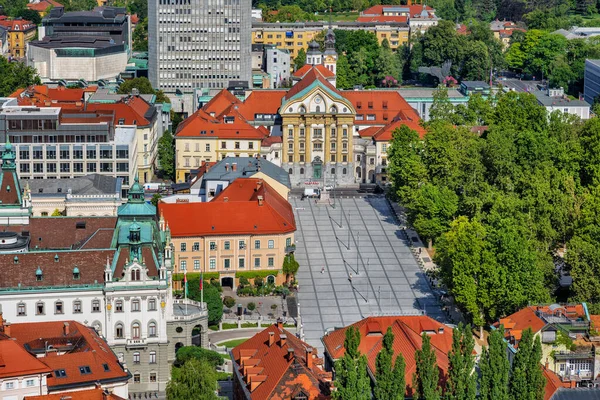 City center of Lubljana in Slovenia, Congress Square, Park Zvezda, Church of the Holy Trinity and University building, aerial view.