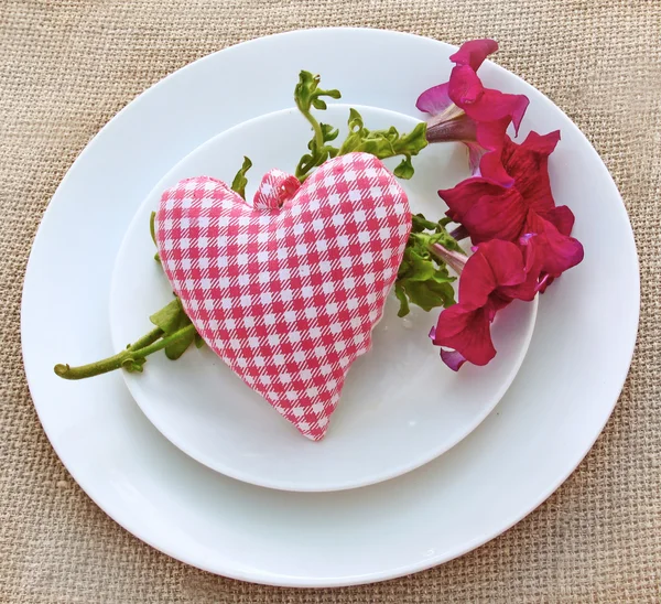 Romantic serving with a bouquet of petunia and heart — Stock Photo, Image