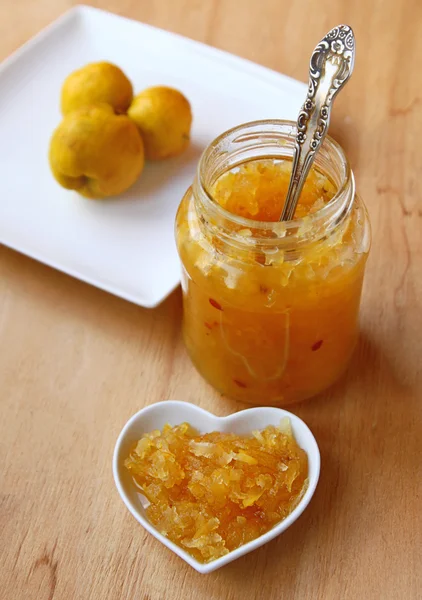 Home cooking from a quince on a wooden table — Stock Photo, Image