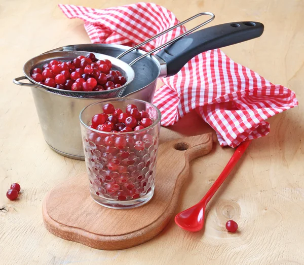 Berries of cranberry in glass — Stock Photo, Image