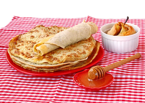 Pile of pancakes with honey and pear in a puff test — Stock Photo, Image