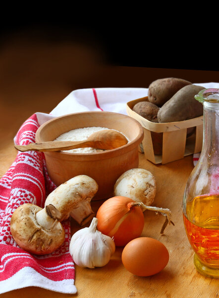 Potato, flour, mushrooms and egg for cooking of dumplings or gn
