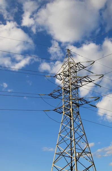 Metal support power lines against the blue sky — Stock Photo, Image