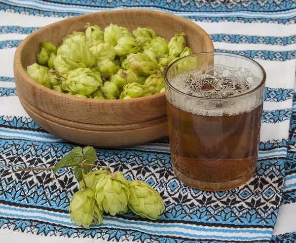 Glass with a drink of hops — Stock Photo, Image