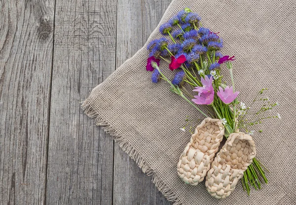 Rural still life with a bouquet of blue flowers and decorative s — Stock Photo, Image