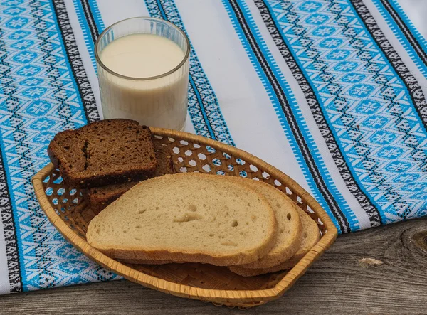 Glass of milk and rye bread — Stock Photo, Image