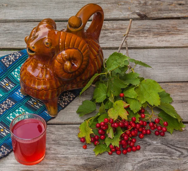 Drink and a branch of viburnum — Stock Photo, Image