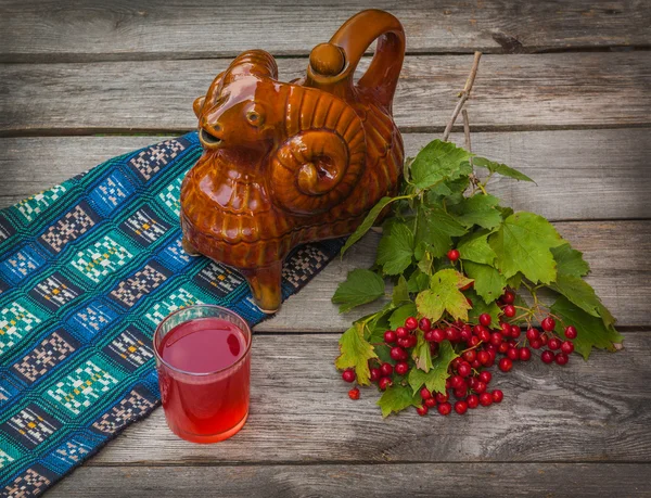 Drink and a branch of viburnum — Stock Photo, Image