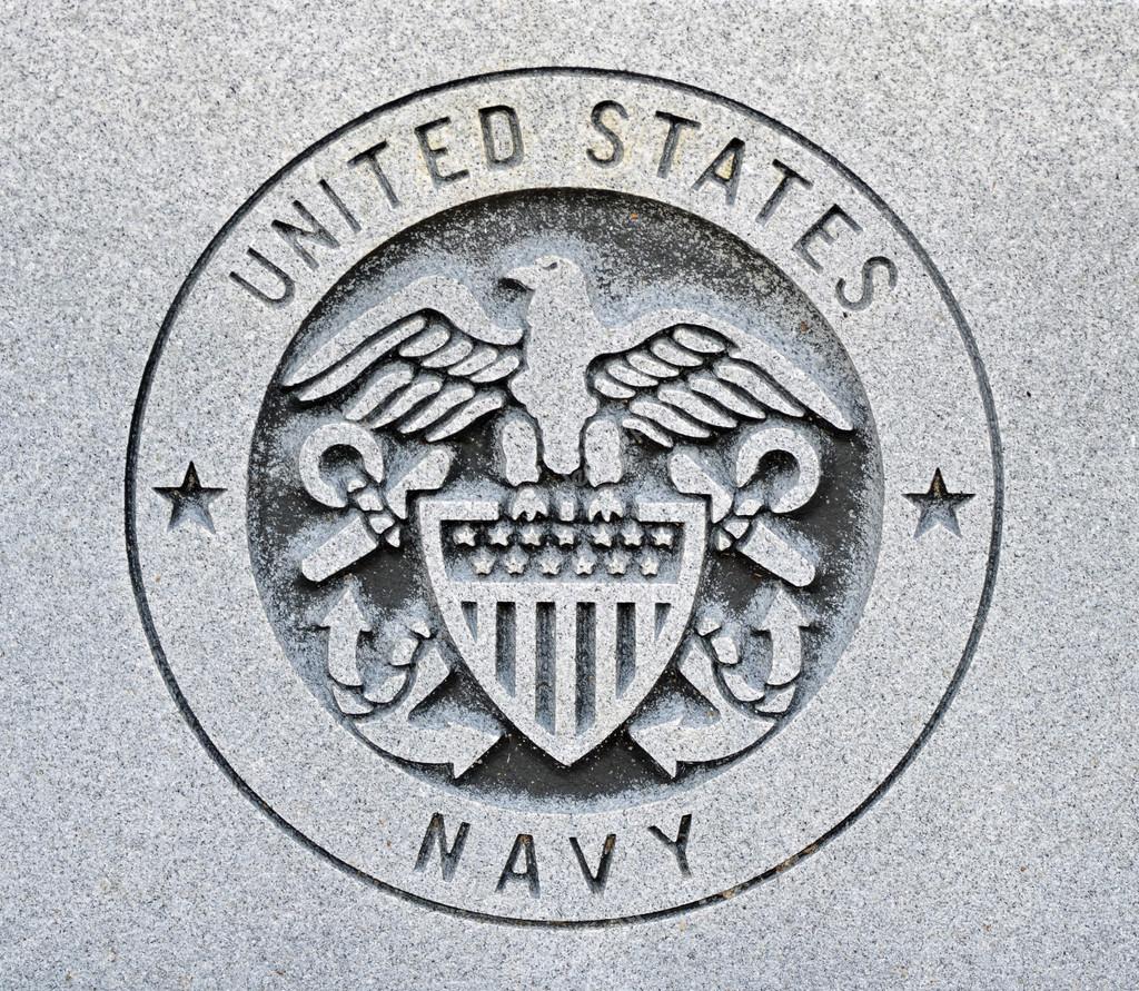 The seal of the United States Navy engraved into granite