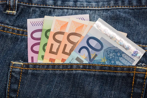 Euro banknotes in jeans back pocket — Stock Photo, Image