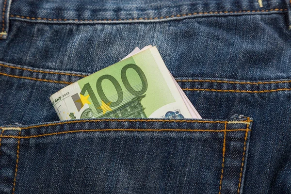 Euro banknotes in jeans back pocket — Stock Photo, Image