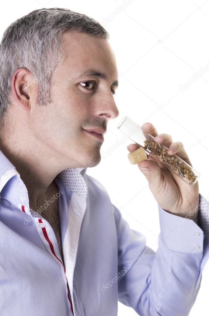 Man smelling a perfume