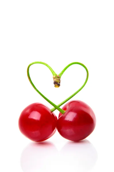 Heart shape from two cherries over white — Stock Photo, Image