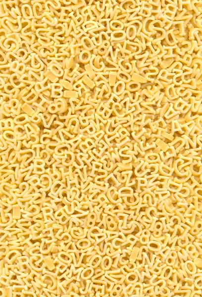 Hintergrund der Pasta in Form von Zahlen und Buchstaben — Stockfoto