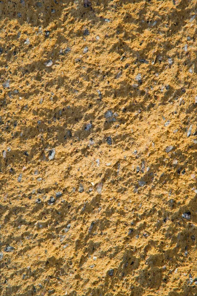 マイクロライト時代の歴史芸術スタイルの強い硬質固体玄武岩の建物の床を閉じます 暗い素朴な汚れた黄色のオリーブ明るい色のドライクラックシームレスな強度石英花崗岩コンクリート効果テキストスペースビュー — ストック写真