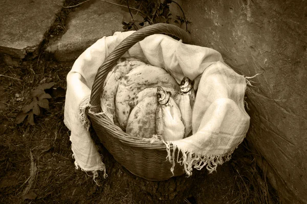 Holy fresh raw simple rural box barley pita cake bakery Lord pray bless retro age Israel sign story. Closeup view jew towel cloth catholic supper still life outdoor stone garden wall field text space