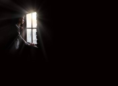 Old retro antique life young teen age frown boy guy face feel guilt light sky view. ancient lost tire guilty human cry ask belief god lord Christ love faith hand dark black room text space war concept