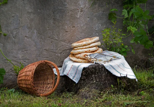 Holy fresh raw simple rural box barley pita cake bakery Lord pray bless retro age Israel sign story. Closeup view jew towel cloth catholic supper still life outdoor stone garden wall field text space