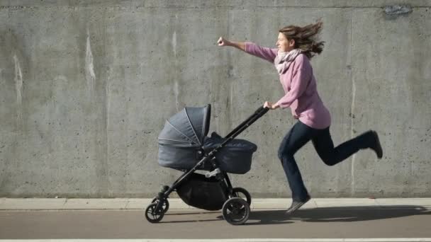 Strong Powerful Woman Jumping While Pushing Baby Carriage Happy Cheerful — Stock Video