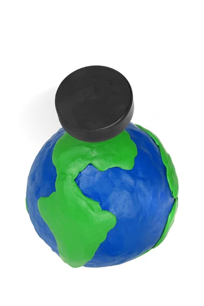 Plasticine globe and hockey puck — Stock Photo, Image