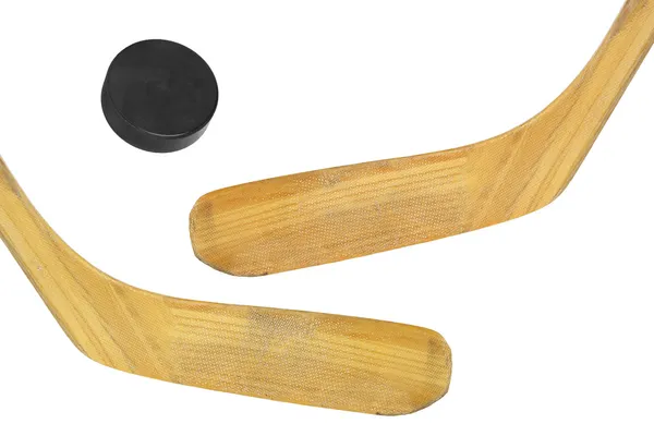 Two hockey sticks and puck — Stock Photo, Image